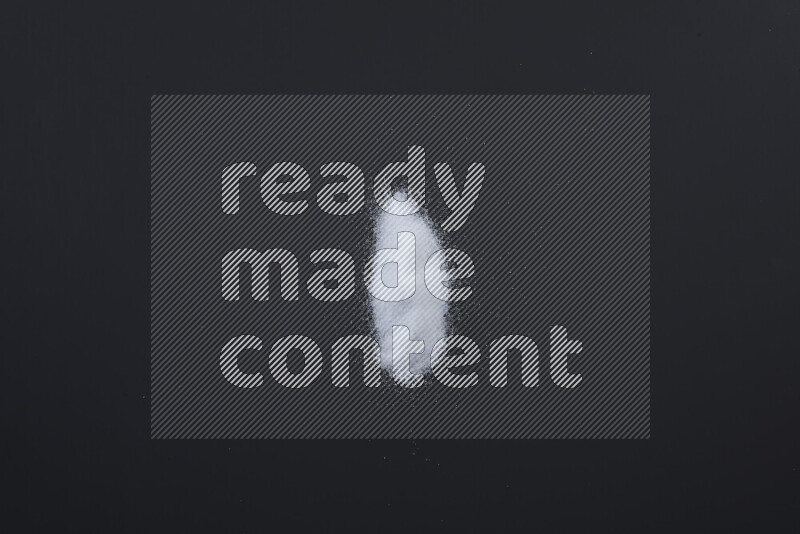 Bunches of table salt, coarse sea salt, fine himalayan salt and coarse himalayan salt on black background