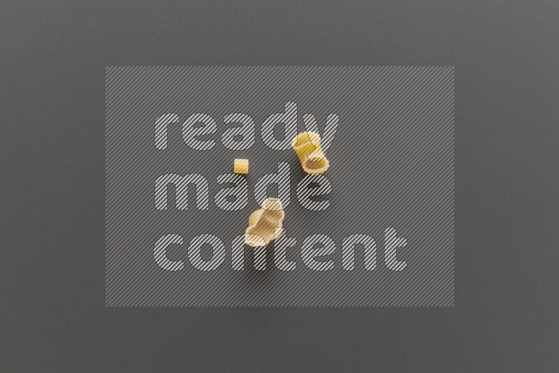 Different pasta types on grey background