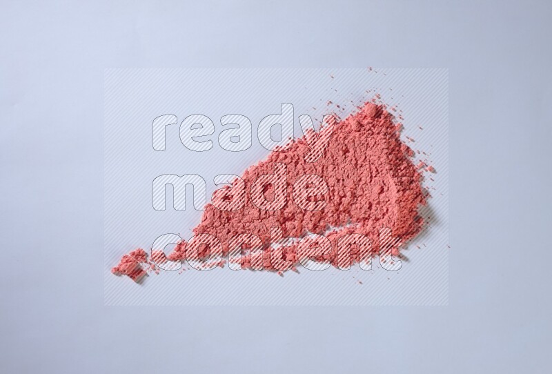 Red powder smears on white background