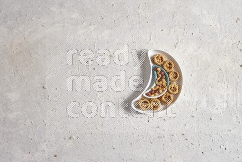 Oriental sweets in a pottery plate in a light setup