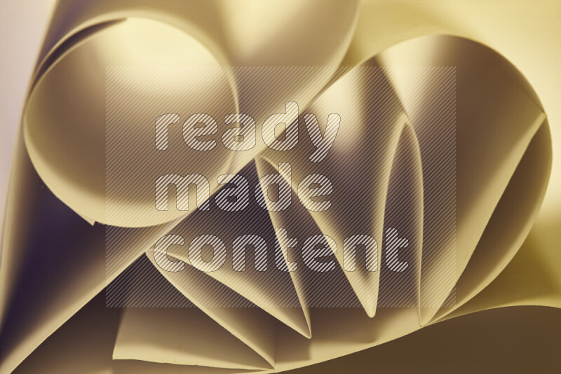 An artistic display of paper folds creating a harmonious blend of geometric shapes, highlighted by soft lighting in warm tones