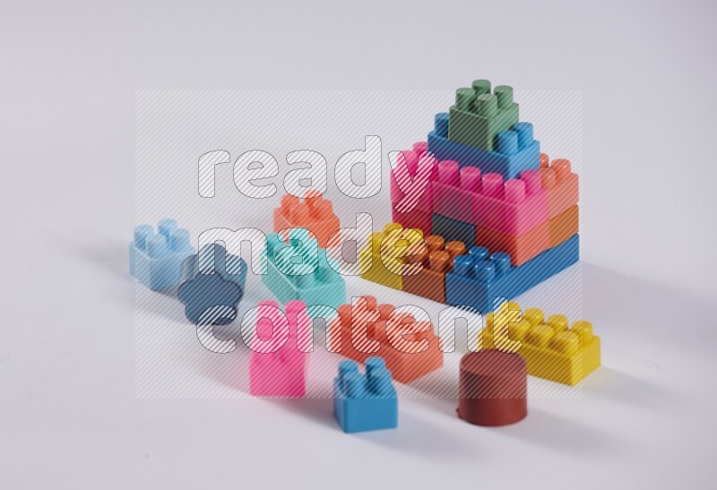 Collection of colorful different kids toys on white background