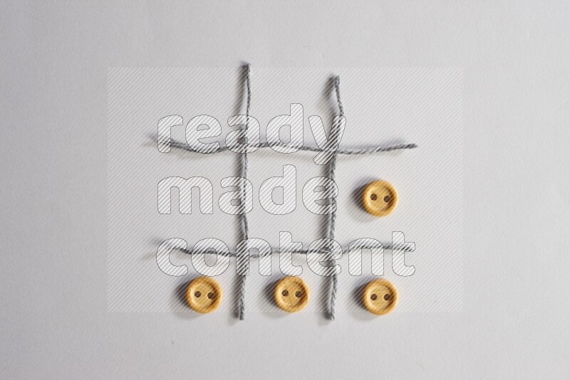 Wooden buttons placed on grey background