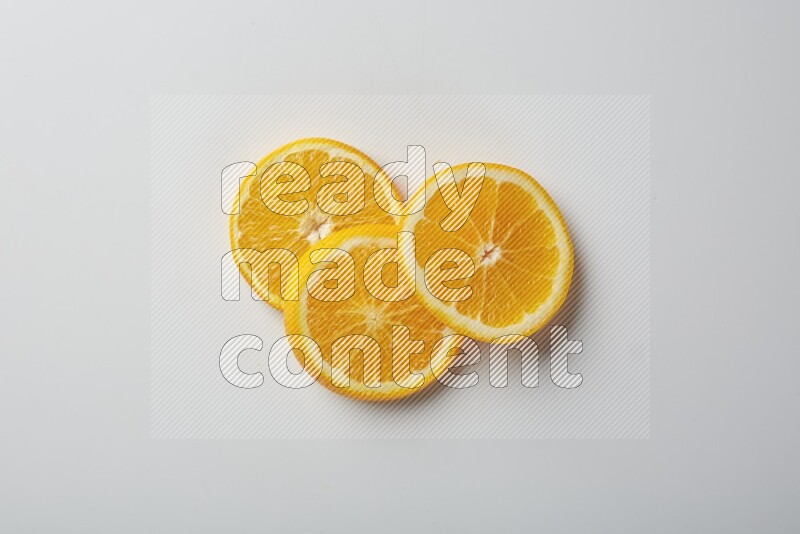 Three orange slices on a white background