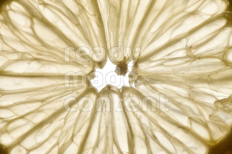 Lemon slices on illuminated white background