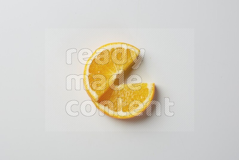 Two halves of an orange slices on white background