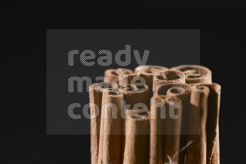 Cinnamon sticks on black background