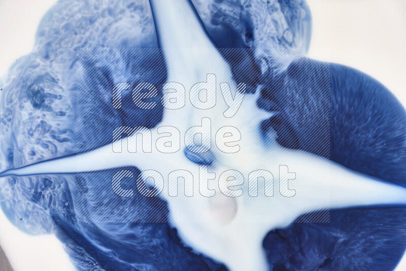 A close-up of abstract swirling patterns in blue and white