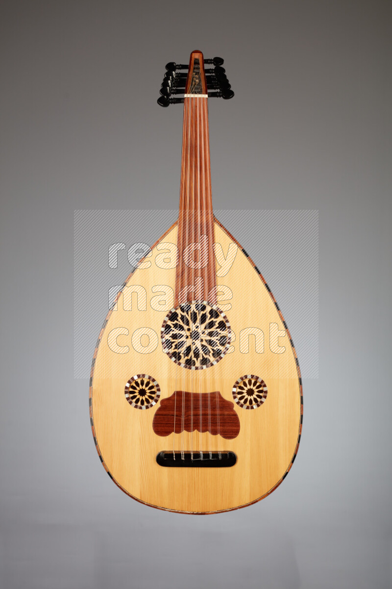 a wooden brown Oud on a gray background