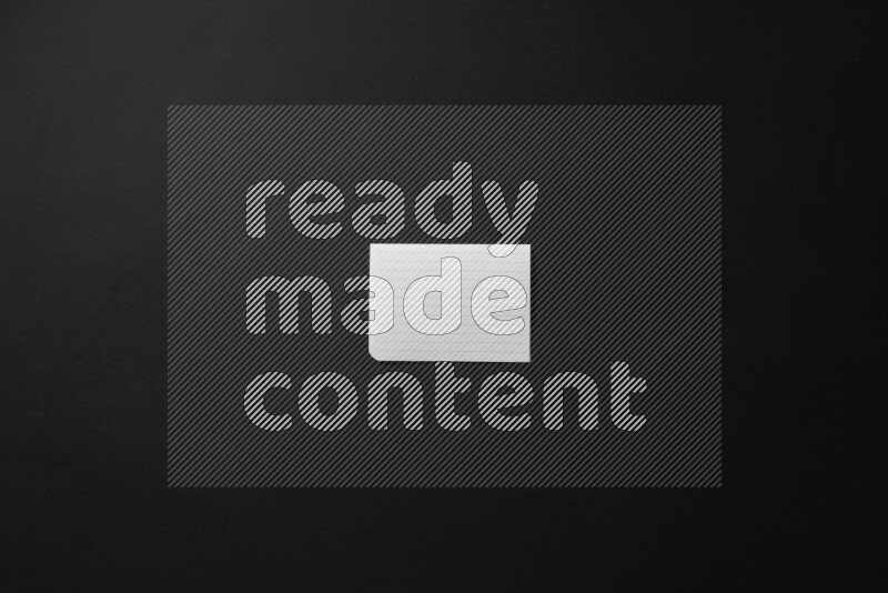 Folded notebook sheet on black background