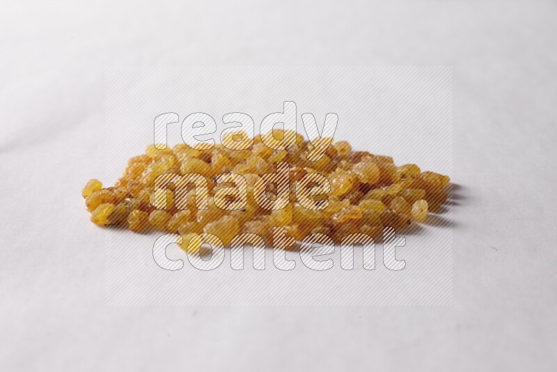 Raisins on white background