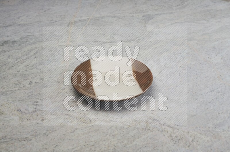 Multicolored Pottery Plate On Grey Marble Flooring