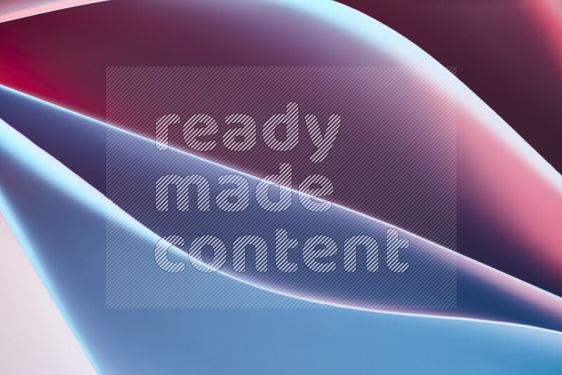 This image showcases an abstract paper art composition with paper curves in blue and red gradients created by colored light