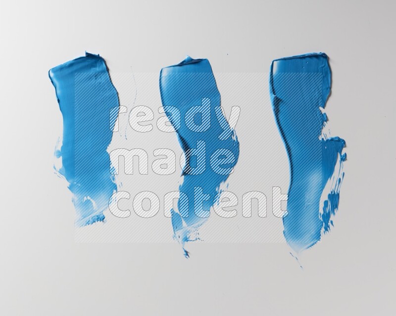 Blue zigzag painting knife strokes on white background