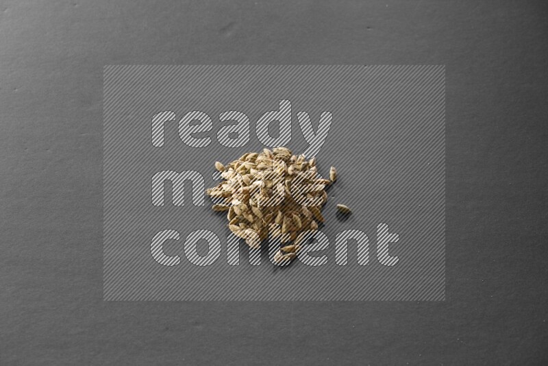 Cardamom on a black flooring