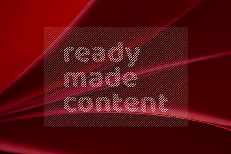 An abstract art showing red paper sheets arranged in an overlapping curves