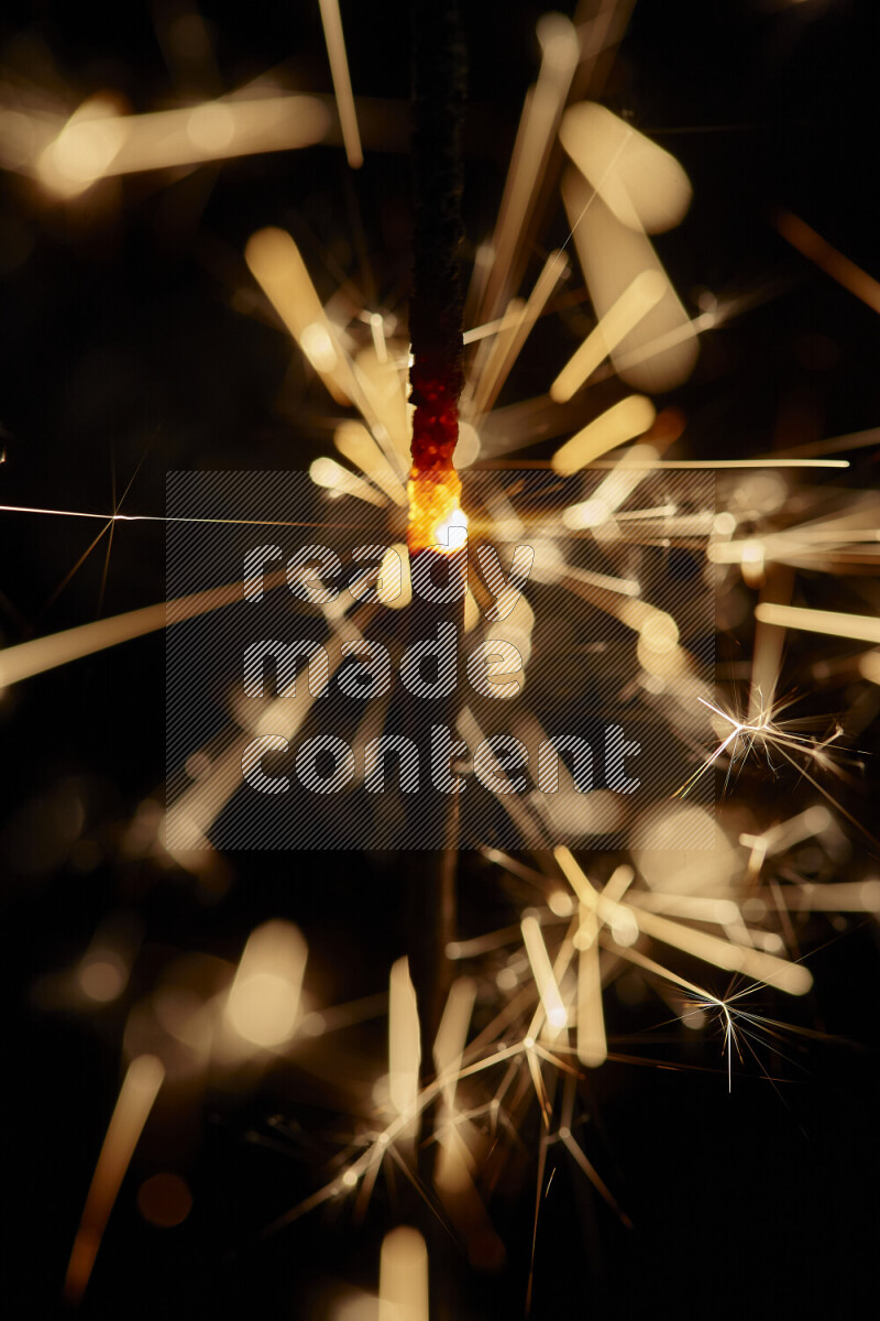 A close-up image of sparkler candle isolated on black background