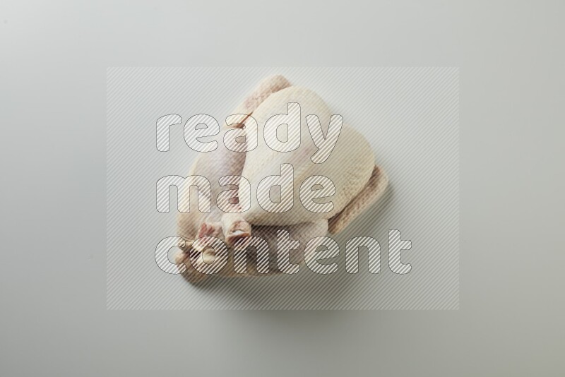 Whole fresh chicken direct on a white background