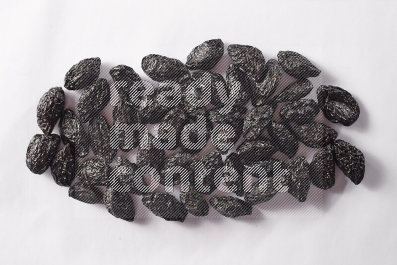 Dried plums on white background