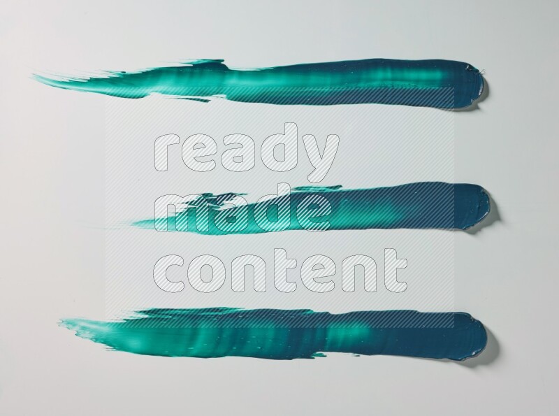 Turquoise painting knife strokes on white background