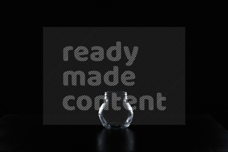 Glassware with rim light against black background