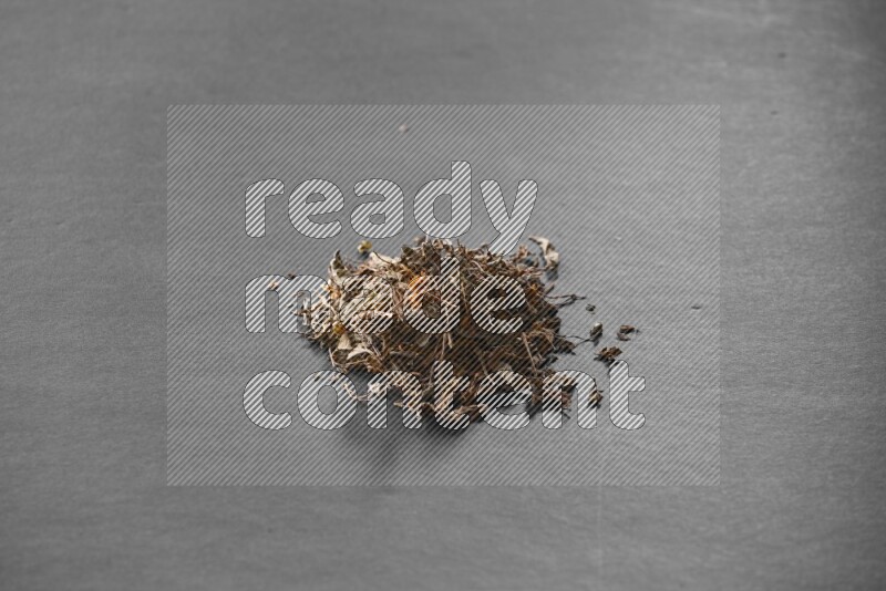 Dried basil on a black flooring