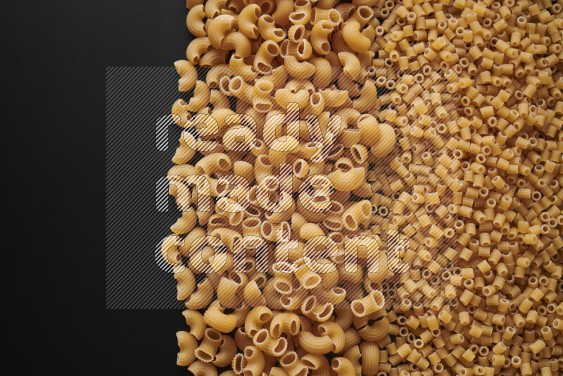 Different pasta types on black background