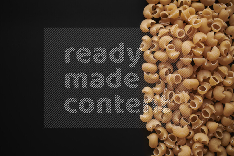 Different pasta types on black background