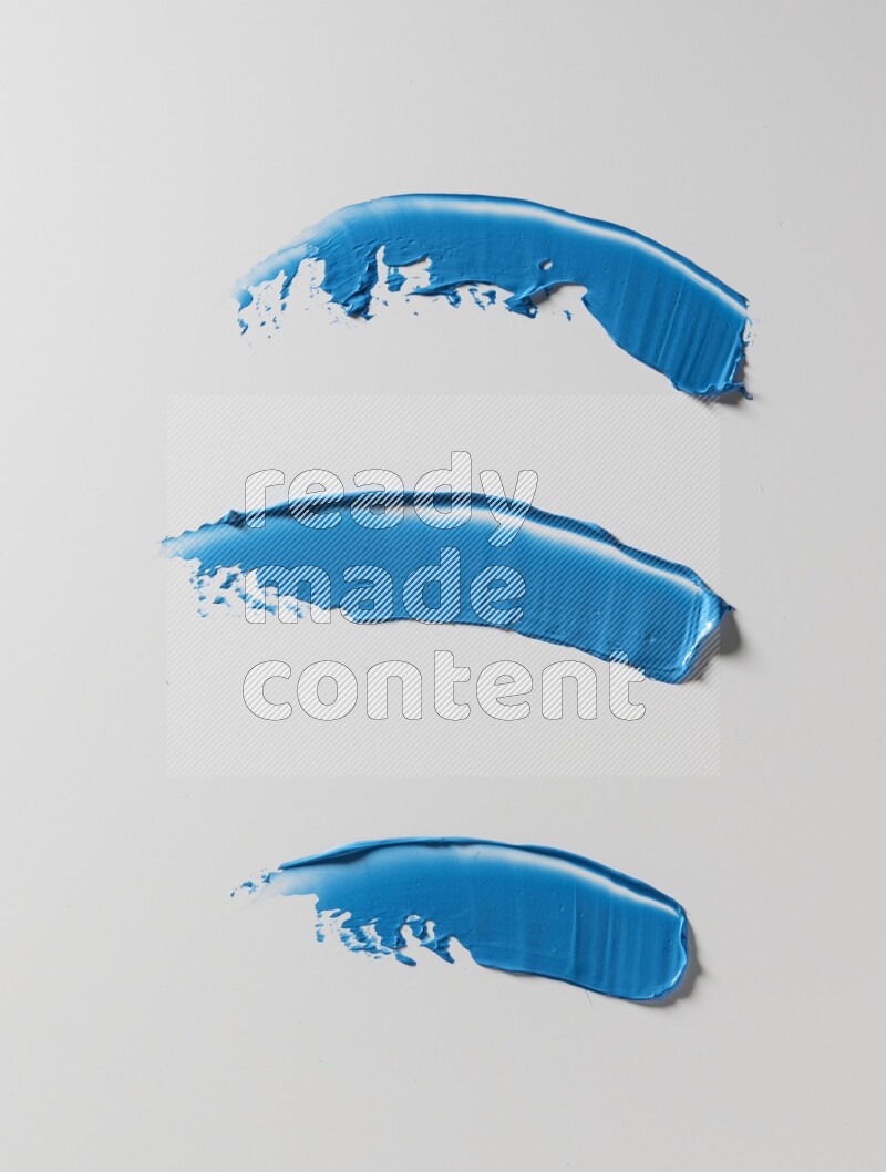 Blue painting knife strokes on white background
