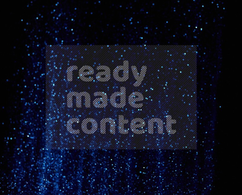Blue glitter powder isolated on black background