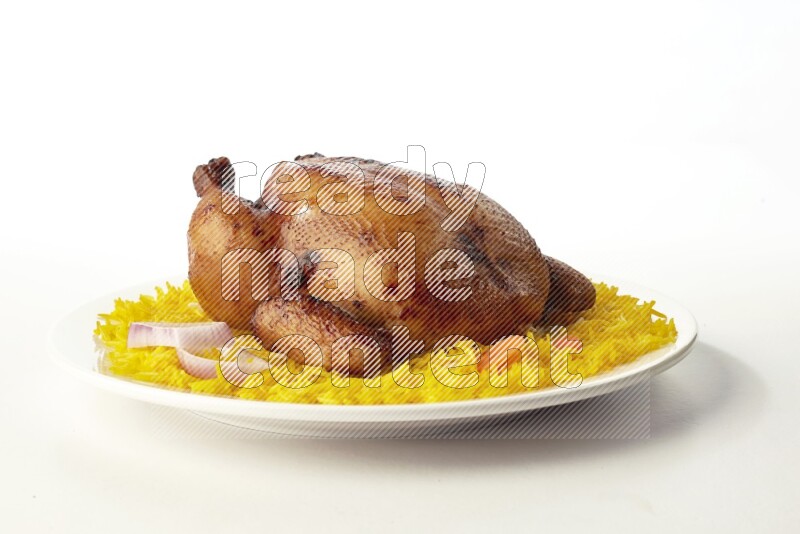 yellow  basmati Rice with  whole roasted chicken on a white rounded plate direct on white background