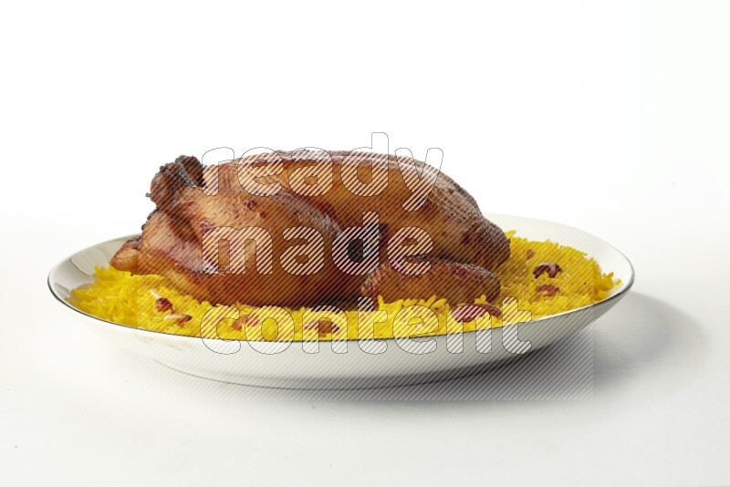 yellow  basmati Rice with kabsa chicken pieces on a white plate with a silver rim direct on white background