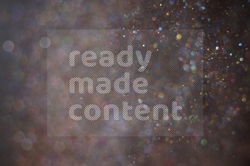 Multicolored glitter powder isolated on black background