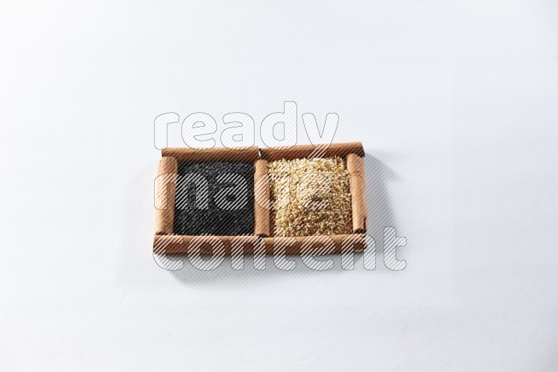 2 squares of cinnamon sticks full of sesame and black seeds on white flooring