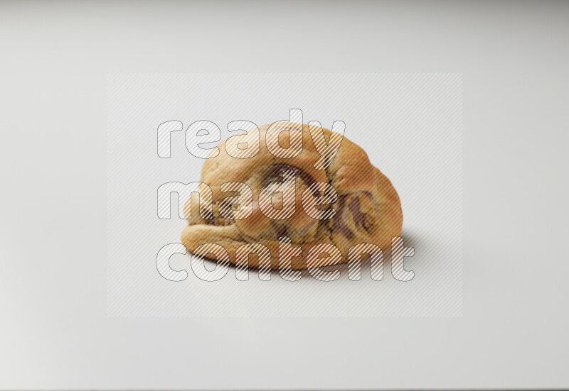 a chocolate chip cookie on a white background