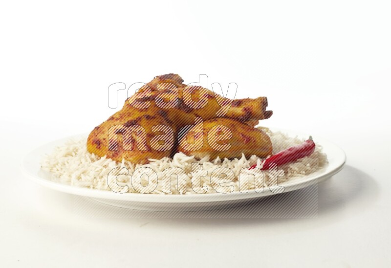 white  basmati Rice with  kabsa chicken pieces  on a white rounded plate direct on white background