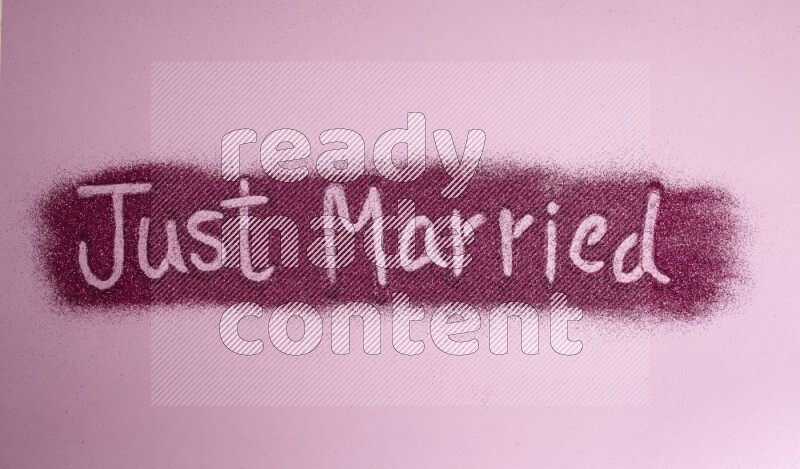 A sentence written with pink glitter on pink background