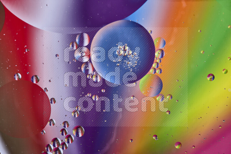 Close-ups of abstract oil bubbles on water surface in multicolors