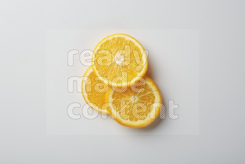 Three orange slices on a white background