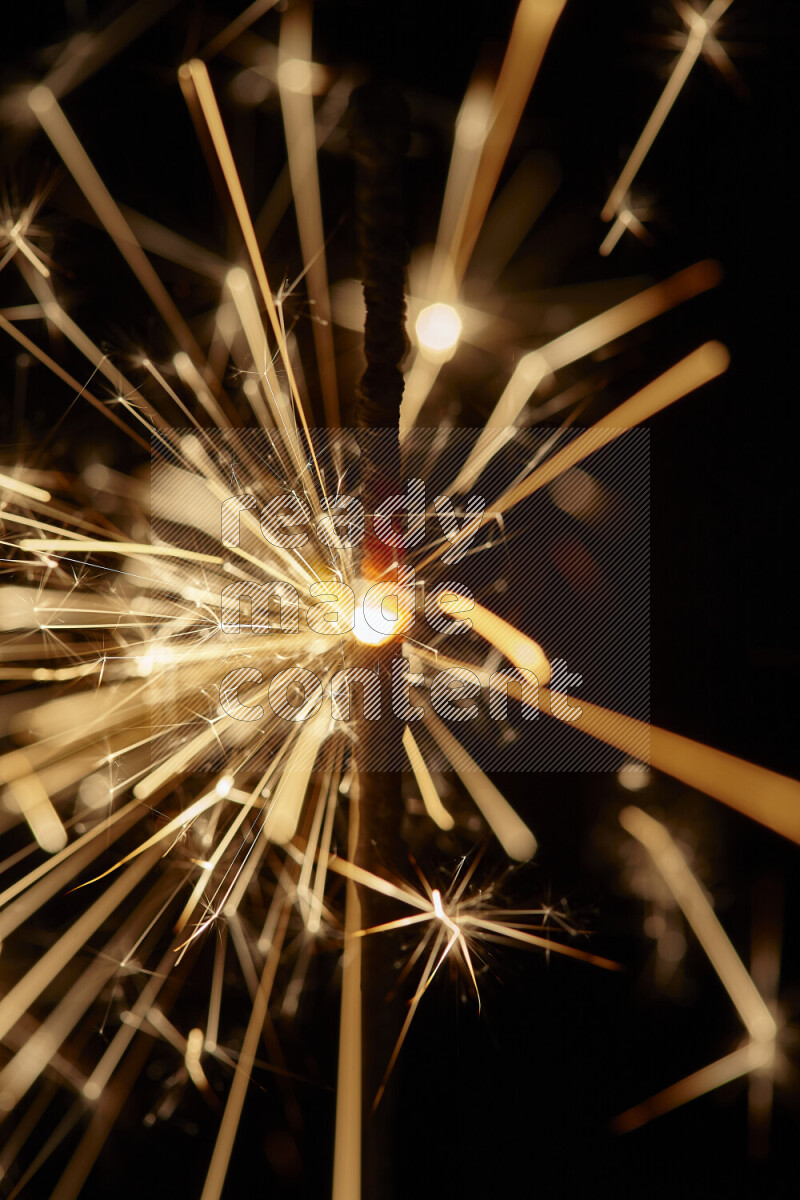 A close-up image of sparkler candle isolated on black background