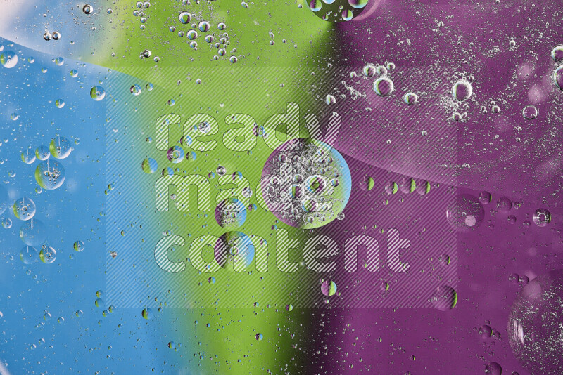 Close-ups of abstract oil bubbles on water surface in shades of purple, green and blue