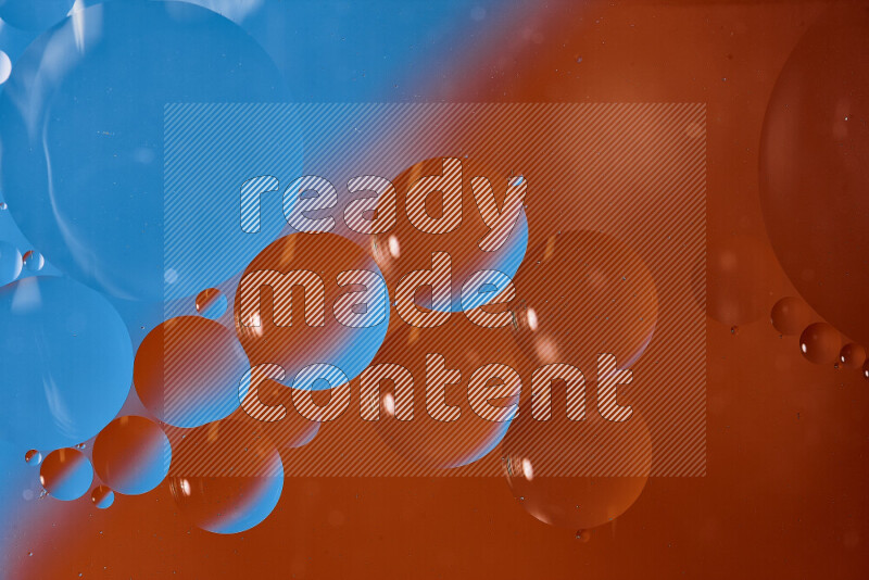 Close-ups of abstract oil bubbles on water surface in shades of blue and orange