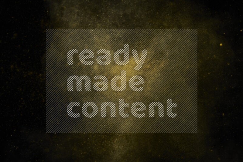 Yellow powder explosion on black background