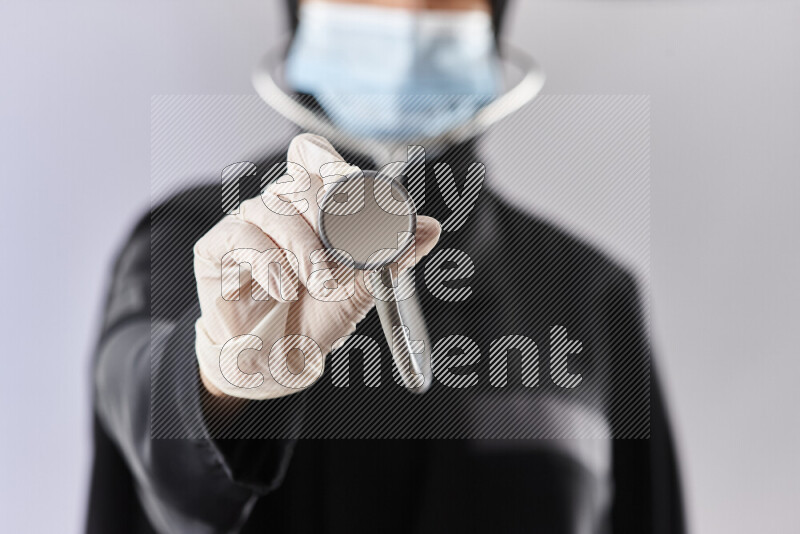 Female doctor wearing an abaya and medical attire in different positions