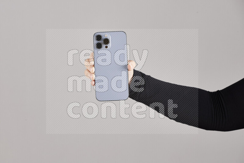 Woman hands holding different mobile phones in different positions
