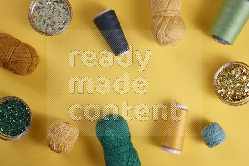 A green collection of sewing and tailoring tools arranged on a yellow background