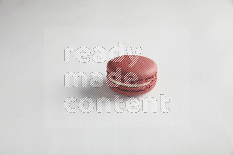45º Shot of Red Velvet macaron on white background