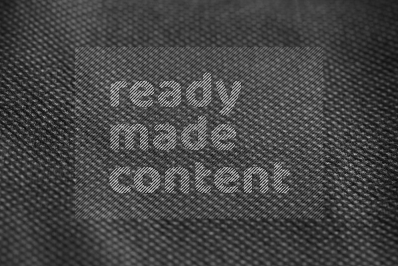 Fabric bags texture on black background