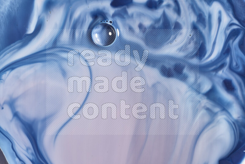 A close-up of abstract swirling patterns in blue, red and white