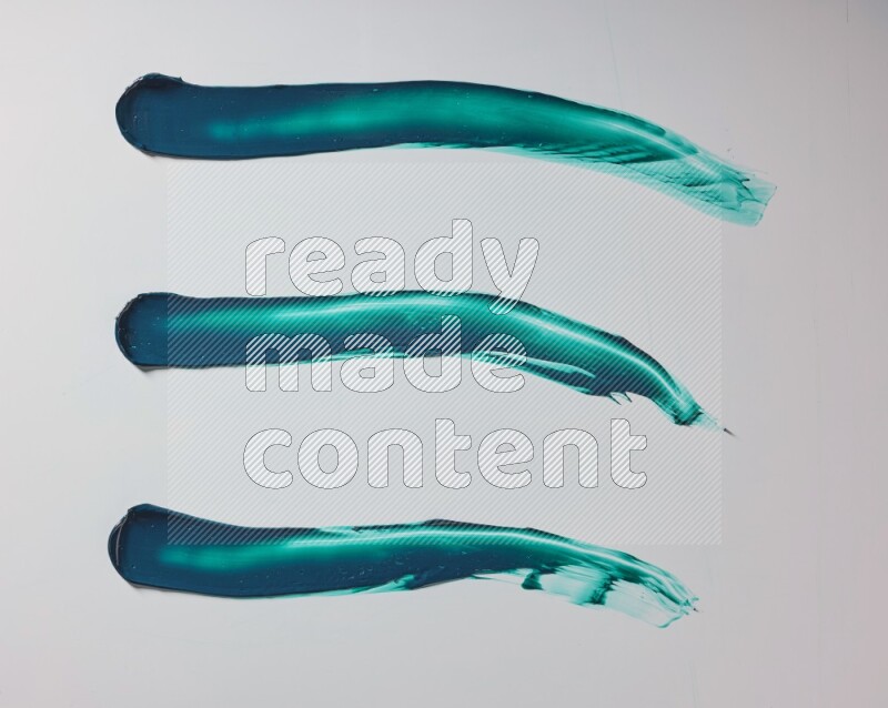 Turquoise painting knife strokes on white background